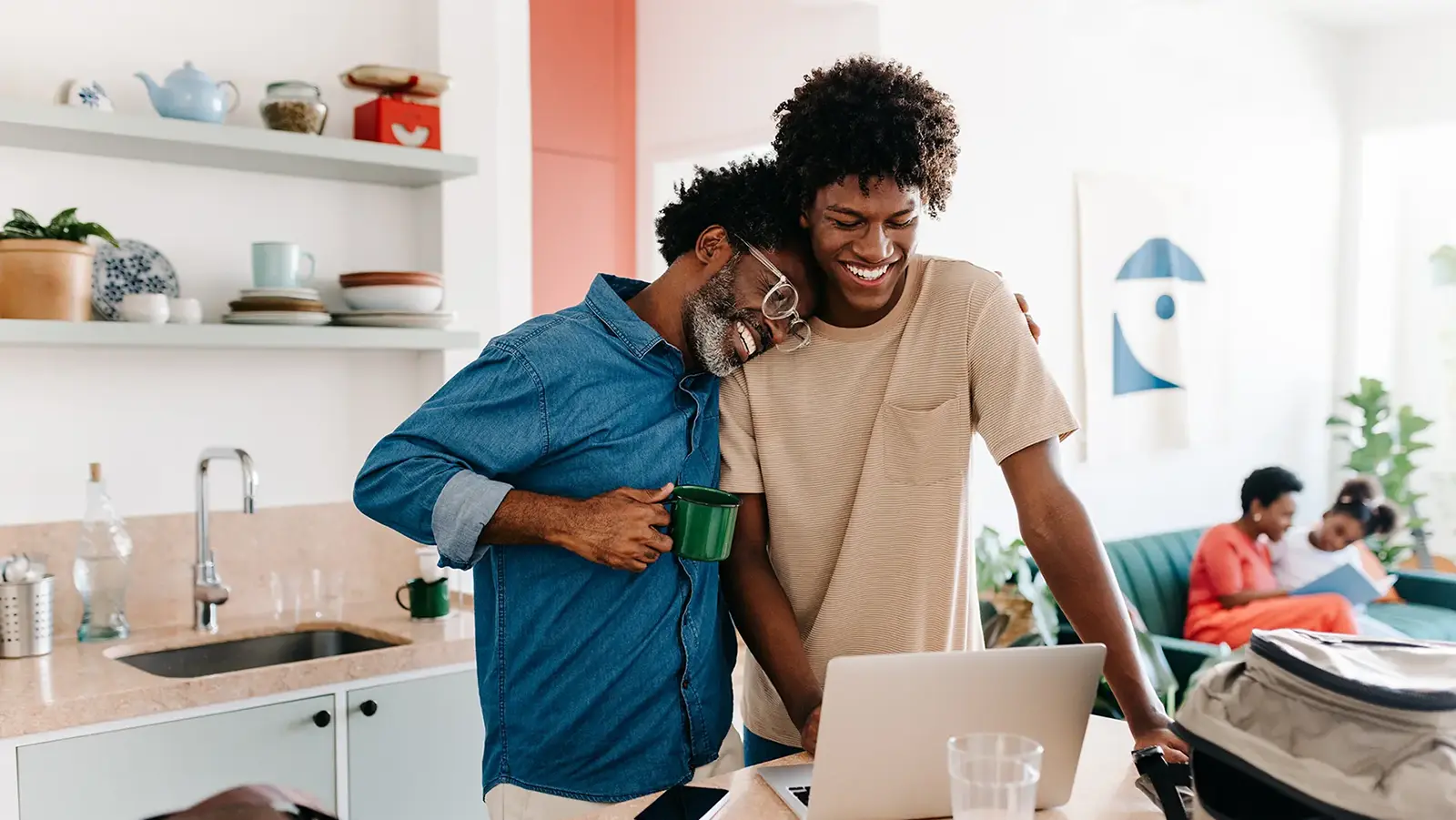 Two men are smiling and standing