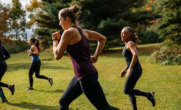 A group of women running outdoors
