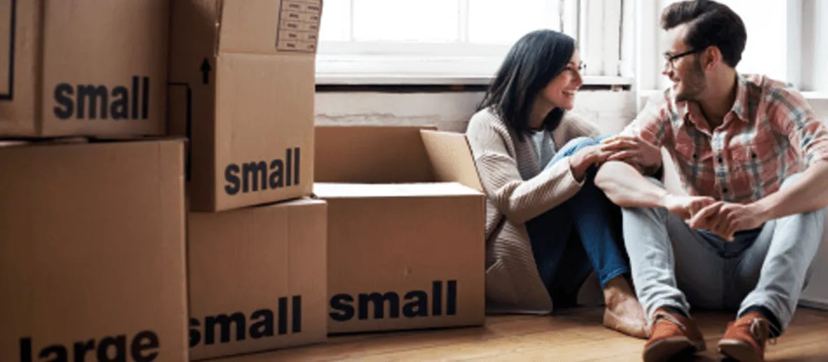 moving house and couple packing up boxes to leave