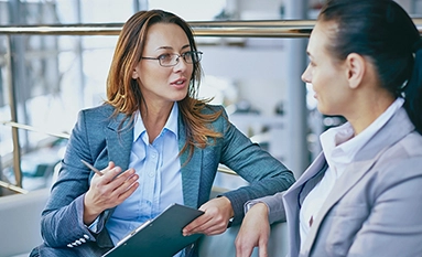 Two female executives in discussion