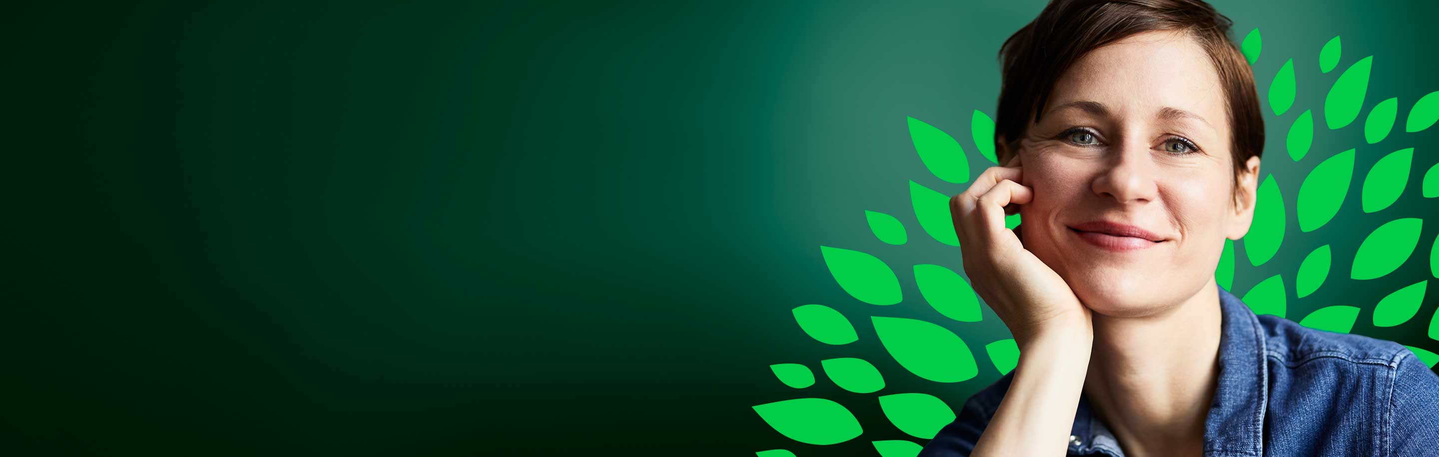 Smiling woman on a green leaf background