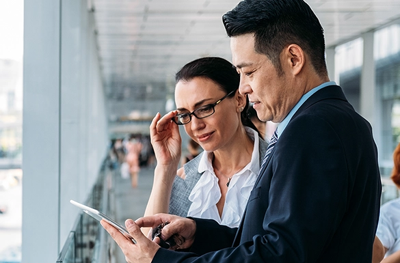 Colleagues reviewing a mobile device screen