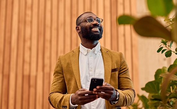 Smiling man on mobile phone