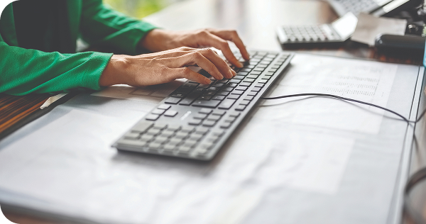 A person typing on keyboard