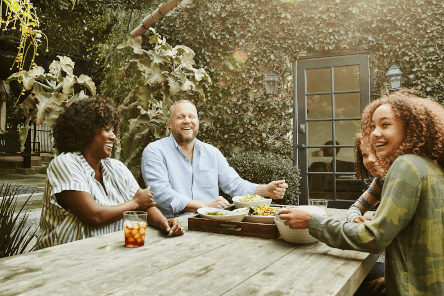 family sitting together on terrace