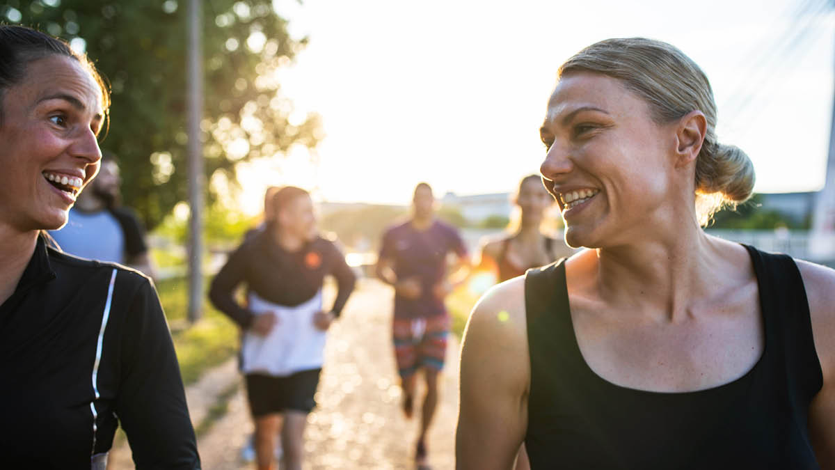 Women smiling while running