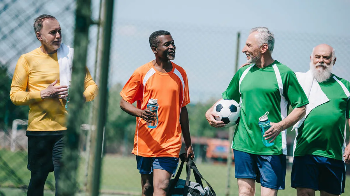 Adults playing football