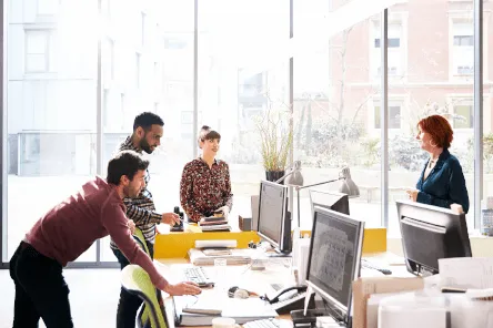 coworkers-talking-in-open-space-office