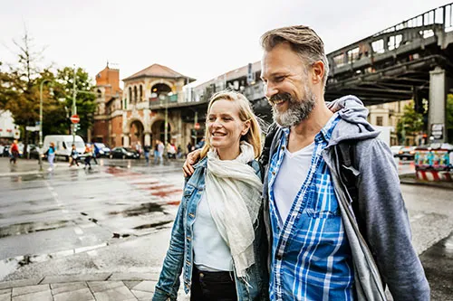 couple walking together, looking happy