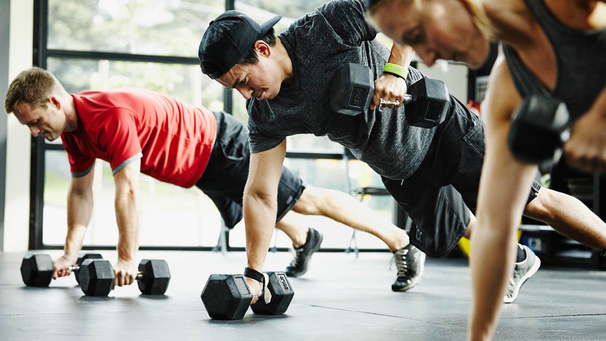 People in gym doing group exercise 