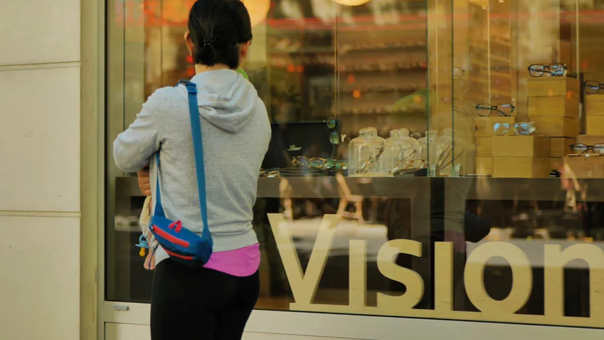 Japanese expat Akiko looking in the window of an opticians in Paris