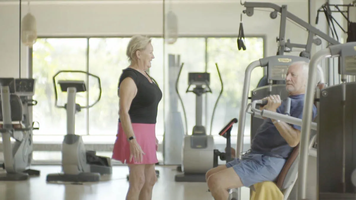 British expat couple Dave and Barb wearing workout clothing in a Spanish gym