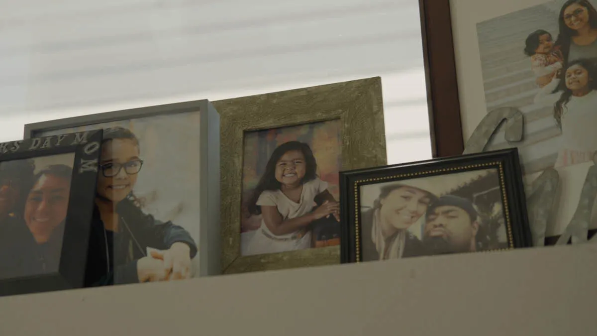 Framed photographs of expat Pate's family at his home in Seattle