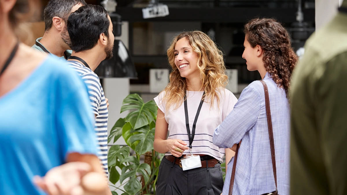 Group of colleagues standing, having a conversation