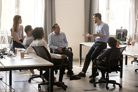 colleagues speaking in meeting