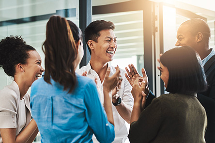 group of expats talking and laughing together